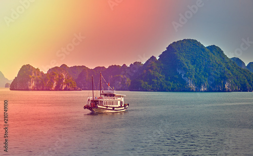 Halong bay boats,Sunset at Ha Long Bay scenic view , Hanoi, Vietnam , Southeast Asia