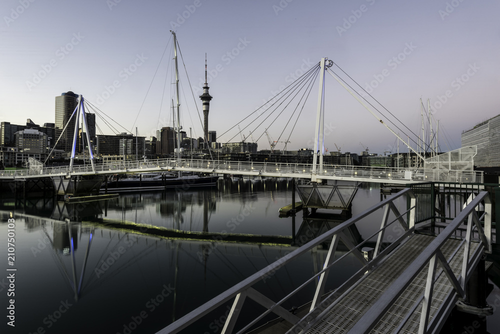 Auckland skyline seen from Viaduct Harbour over the pedestrian bridge