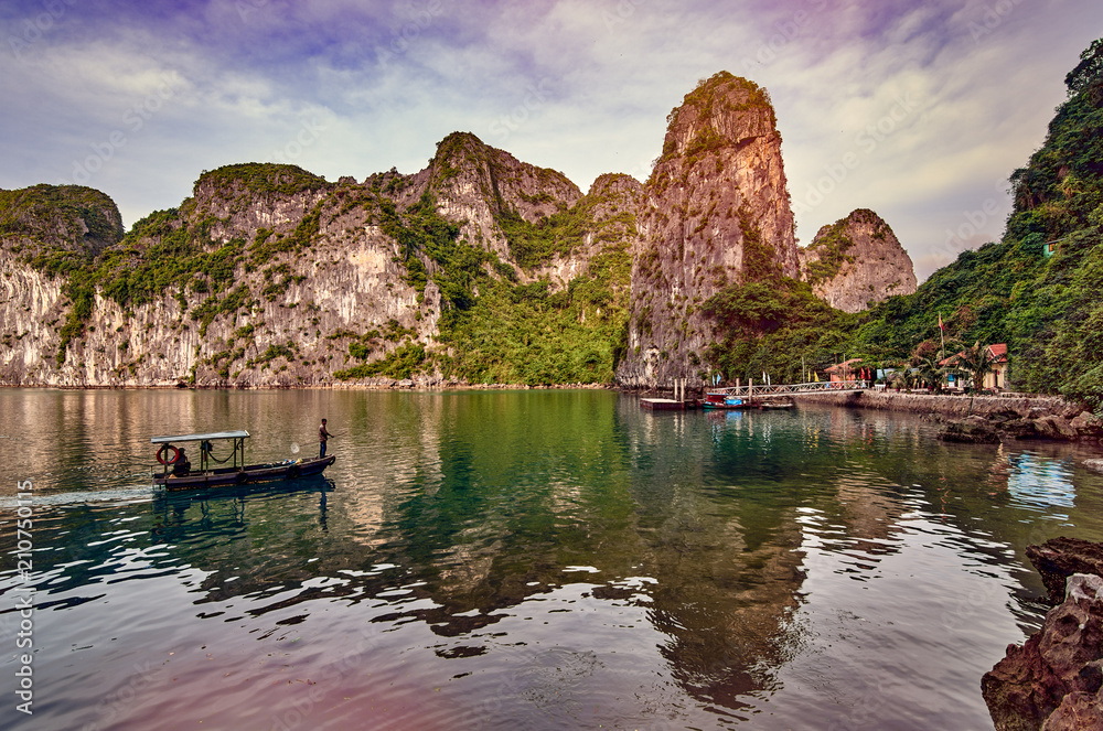 Tourist Junks in Halong Bay,Panoramic view of sunset in Halong Bay, Vietnam, Southeast Asia,UNESCO World Heritage Site