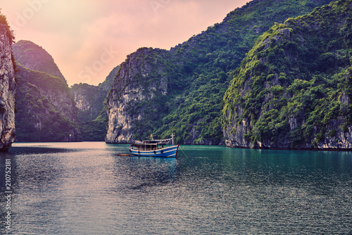 Fishing boats in Ha long Bay, Panoramic view of sunset in Halong Bay, Vietnam, Southeast Asia,UNESCO World Heritage Site