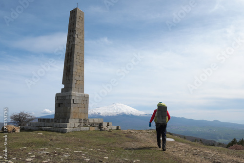 Man With Backpack And Nelson Obelisk In Nebrodi Park, Sicily photo