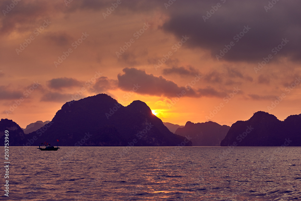 Halong bay boats, Vietnam Panoramic view of sunset in Halong Bay, Vietnam, Southeast Asia,UNESCO World Heritage Site, Poor lighting conditions