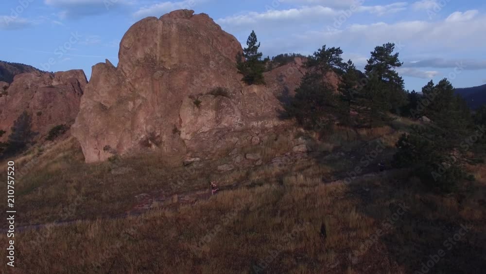 Running on Boulder mountain trail during sunset, aerial Running on Boulder mountain trail during sunset, aerial