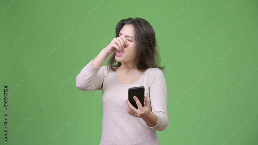 Young beautiful woman using phone and getting good news Young beautiful woman using phone and getting good news