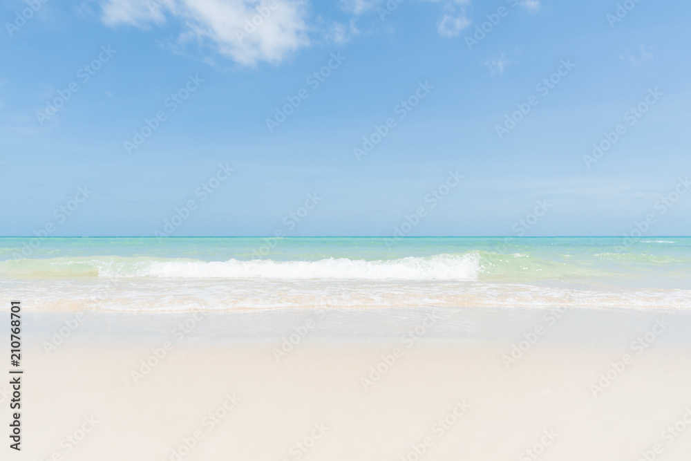 Soft focus of sand beach, blue sky and soft wave background. summer holiday and vacation concept.