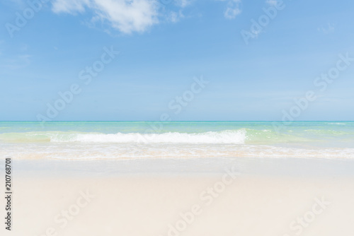Soft focus of sand beach, blue sky and soft wave background. summer holiday and vacation concept. © Siam