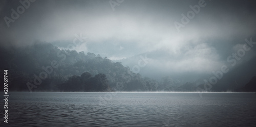 The mist in the lake in the morning. (vintage tone)