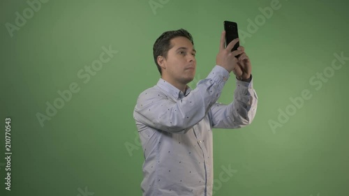 young  latino taking  a photo