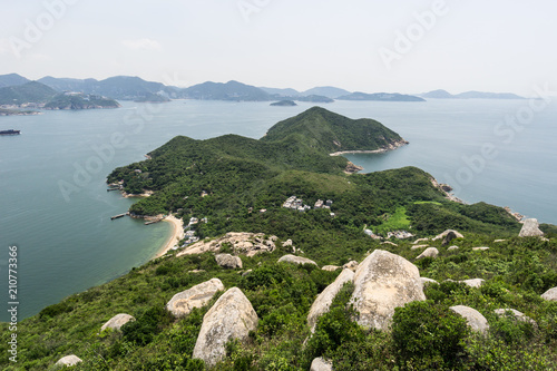 Stunning view of the rugged coastline of Lamma island with Hong Kong island in the background in Hong Kong, China SAR
