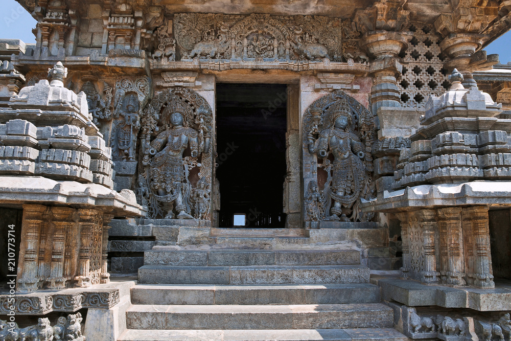 Dwarapala on the right, Ganesha and other sulptures, South entrance of Shantaleswara shrine, Hoysaleshvara Temple, Halebid, Karnataka Dwarapala on the right, Ganesha and other sulptures, South entrance of Shantaleswara shrine, Hoysaleshvara Temple, Halebid, Karnataka