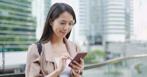 Photography Young woman work on cellphone at outdoor