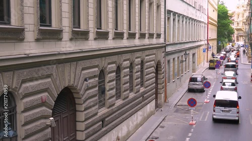 Looking down on moving traffic on a small street in Prague, Czech Republic on June 24 2014 photo