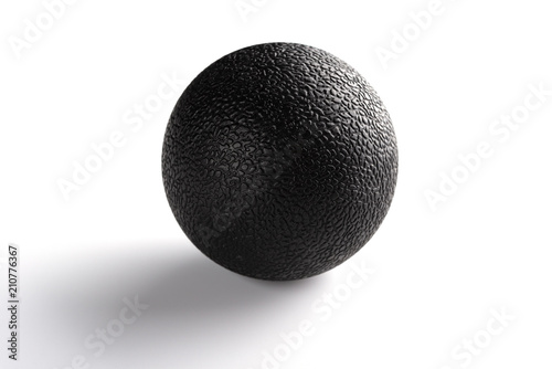 black massage ball on white background