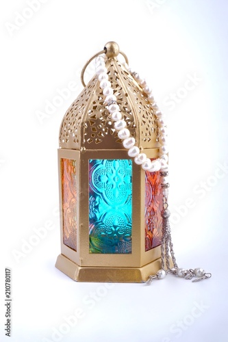 Ramadan / Eid lantern isolated. Arabic decoration lamp on white background. Selective focus and crop fragment