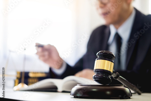 gavel and soundblock of justice law and lawyer working on wooden desk background.