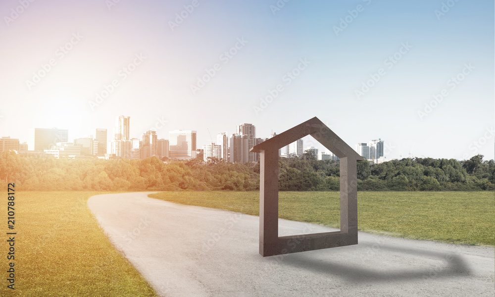 Conceptual background image of concrete home sign on asphalt road