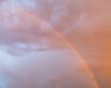 Rainbow in the sky at sunset as background
