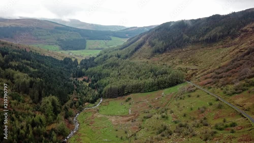 Aerial view of a valley with river and waterfall in Wales - United Kingdom Aerial view of a valley with river and waterfall in Wales - United Kingdom