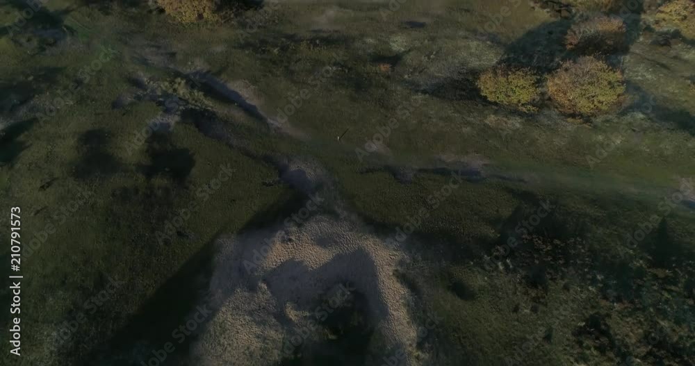 Aerial drone shot of the dutch dunes with a rainbow in the background Aerial drone shot of the dutch dunes with a rainbow in the background