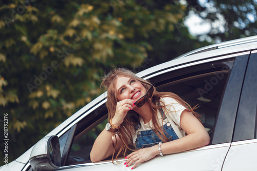 Trendy girl traveling by car