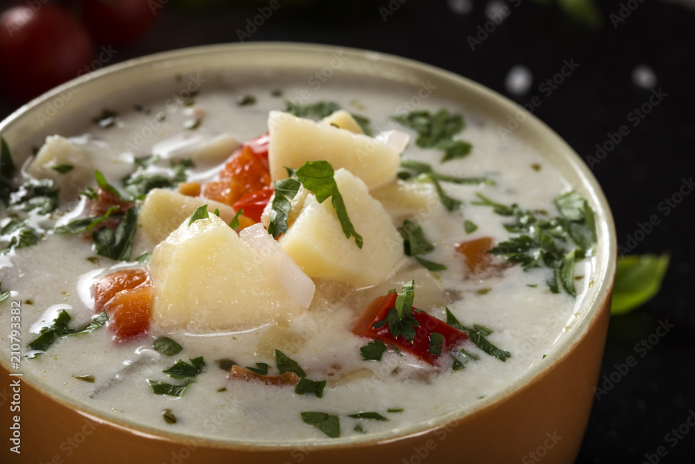 Potatoes soup with different vegetables and sour cream Potatoes soup with different vegetables and sour cream