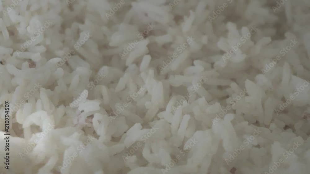 White rice with a slow movement rotation of camera, with some soft light White rice with a slow movement rotation of camera, with some soft light