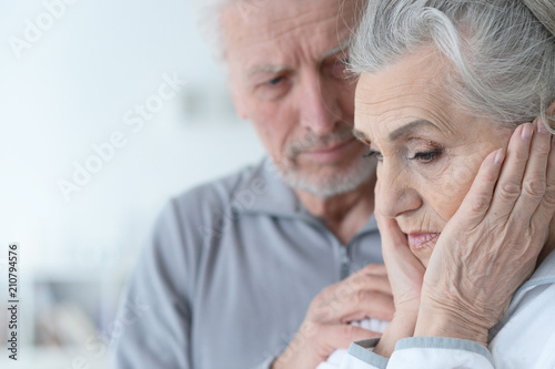 Sad Senior couple at home 