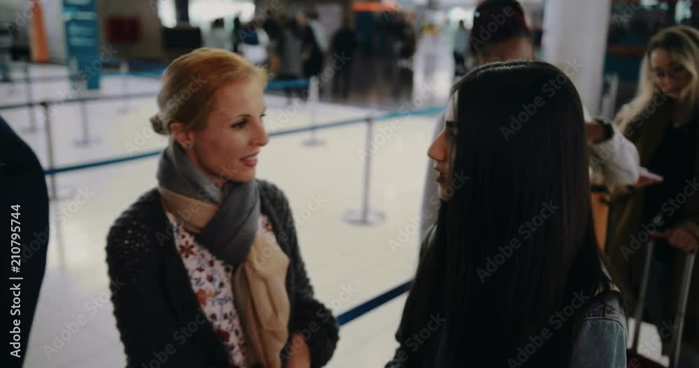 Multi-ethnic people waiting in queue at airport