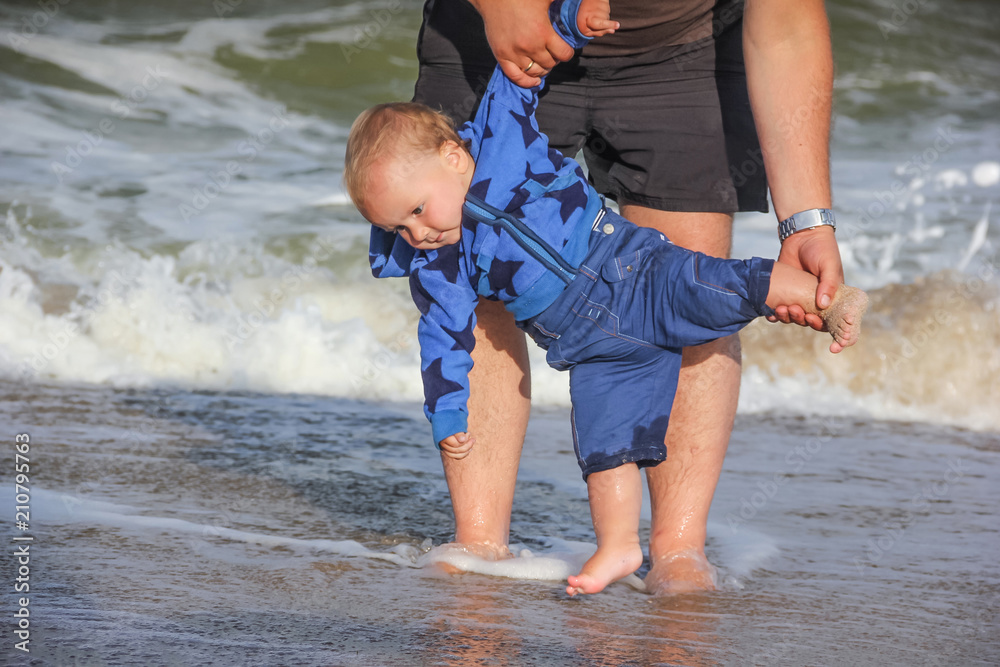 Playing on the seashore of a son with his father Playing on the seashore of a son with his father