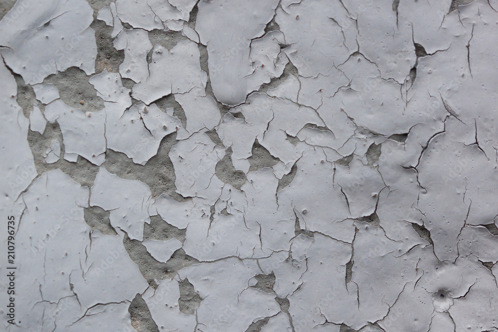 Rough painted wall with pieces of gray paint. Seamless texture. Used as a background. Rough painted wall with pieces of gray paint. Seamless texture. Used as a background.