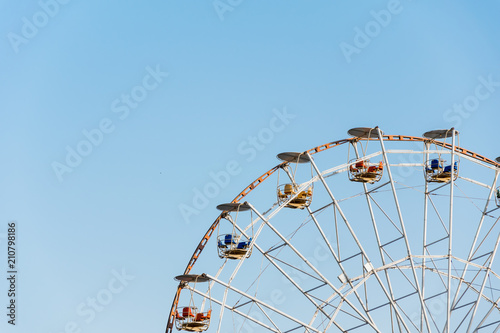 Ferris wheel on blue sky background
