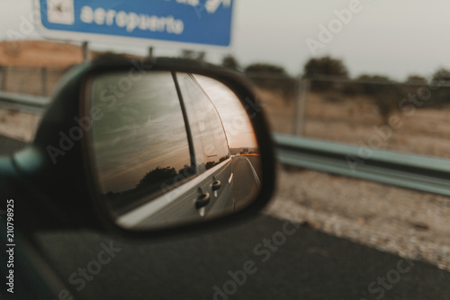 View of the road through the auto van window at sunset. © daviles