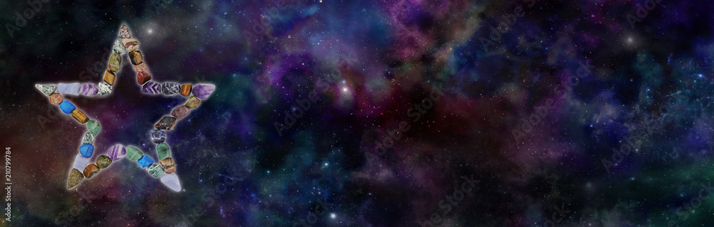 Cosmic Crystal Star Background Banner - a five-point star comprised of different healing stones against a wide deep space blue background with copy space

