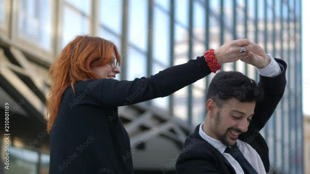 happy business colleagues dance in the street. Success in business, teamwork happy business colleagues dance in the street. Success in business, teamwork