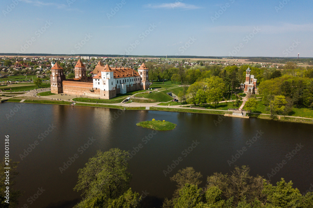 Beautiful aerial view of Medieval Mir castle complex on sunny sp