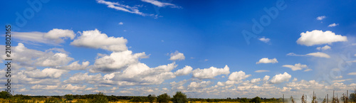 A curly summer clouds on blue sky background © rostyslav84