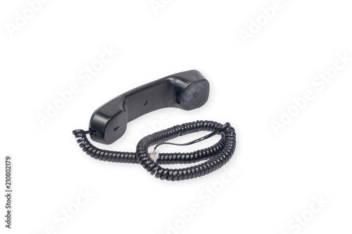 Black handset from landline phone on the white background.