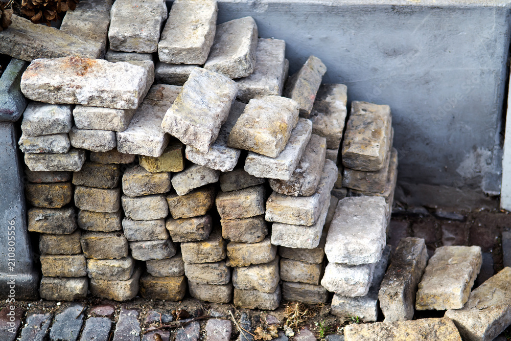 Pile of bricks on one of the city streets (taken by an old pavement) Pile of bricks on one of the city streets (taken by an old pavement)
