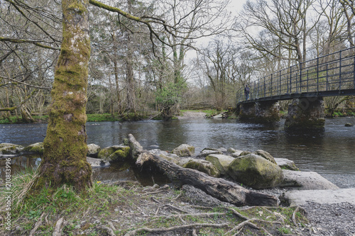 Bridge over River Rothay at White Moss Walks, scenic forest recreational area in Ambleside, Lake District National Park in South Lakeland, England, UK photo