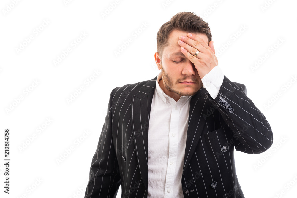 Portrait of business man showing headache gesture. Portrait of business man showing headache gesture.