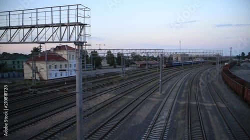 Passenger train rides the station, top view photo