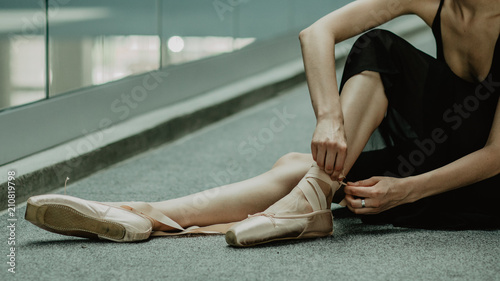 Ballet pointes shoes. Practice makes perfect- ballerina preparing for practices on the dancing hall.