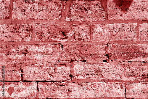 Ancient stone wall in red tone.