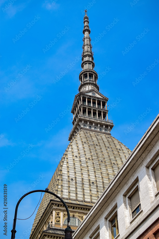 Photograph of the symbol and emblem of the city seen from below and with details in the dome of its roof and is the Mole Antonelliana. Photograph taken in Turin, Italy.