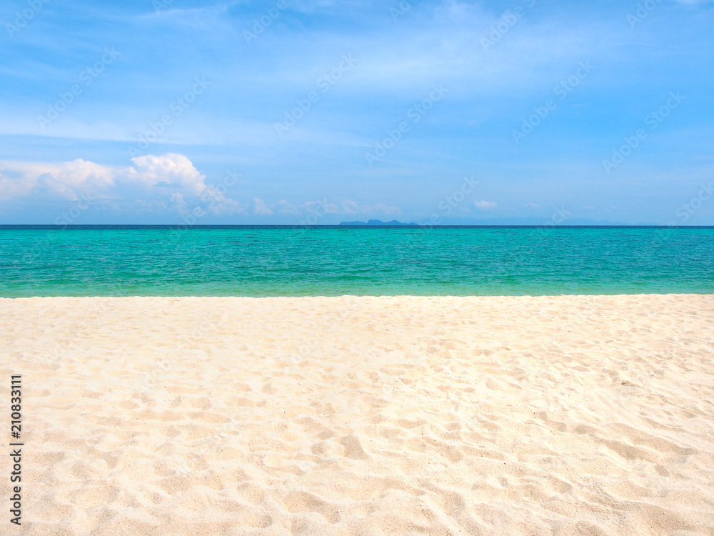 White sand beach and blue sea with blue sky background in sunny summer day  for vacation holiday concept.