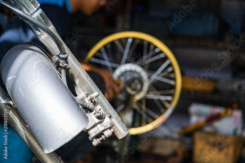 Wallpaper Mural Automobile mechanic repairing motorcycle in bike repair shop Torontodigital.ca