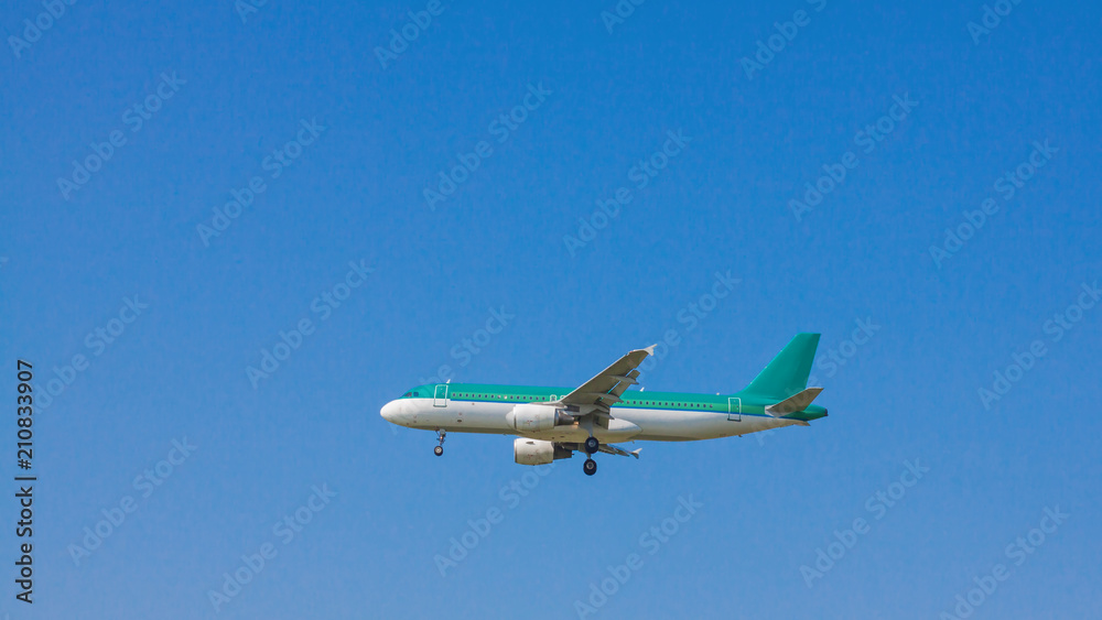 Jet passenger airplane flying with blue sky background. Jet passenger airplane flying with blue sky background.