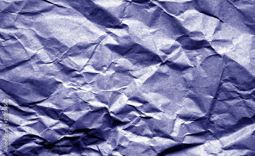 Old crumpled paper with wrinckles in blue color.