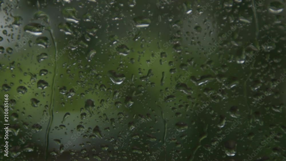 Rain drops on the window during the storm - reverse accelerated video Rain drops on the window during the storm - reverse accelerated video