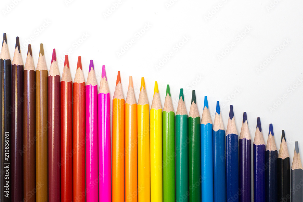 Diagonal of colors pencils on a pure white background. Close up Diagonal of colors pencils on a pure white background. Close up